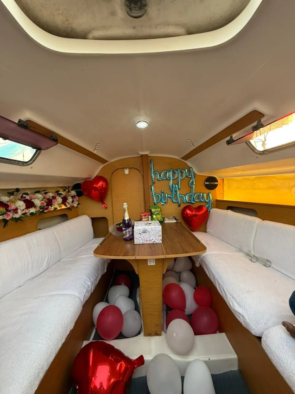 Luxury yacht bedroom cabin decorated for anniversary celebration in Mumbai